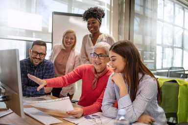 Business people discussing over new business project in office